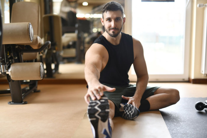 Athlete stretching during a post-training recovery session