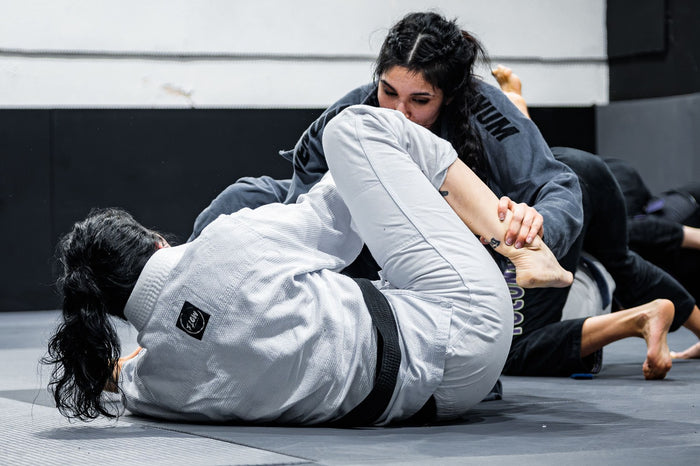 BJJ athletes training on the mat
